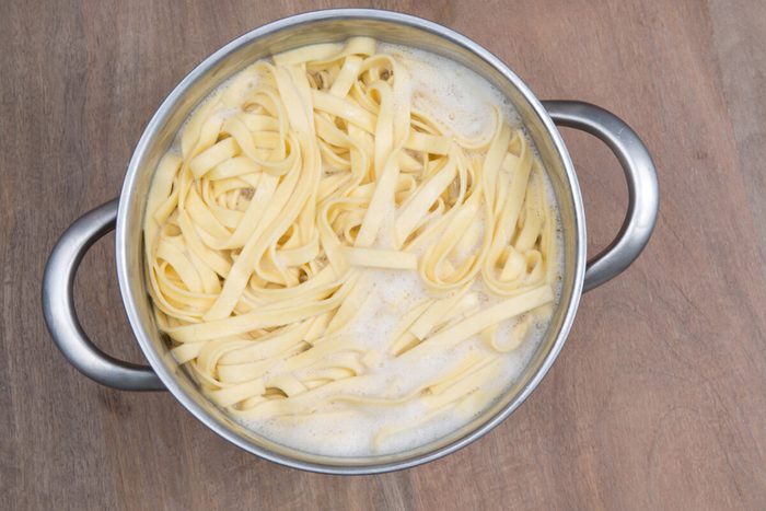 A Food theme: pasta in a boiling water.